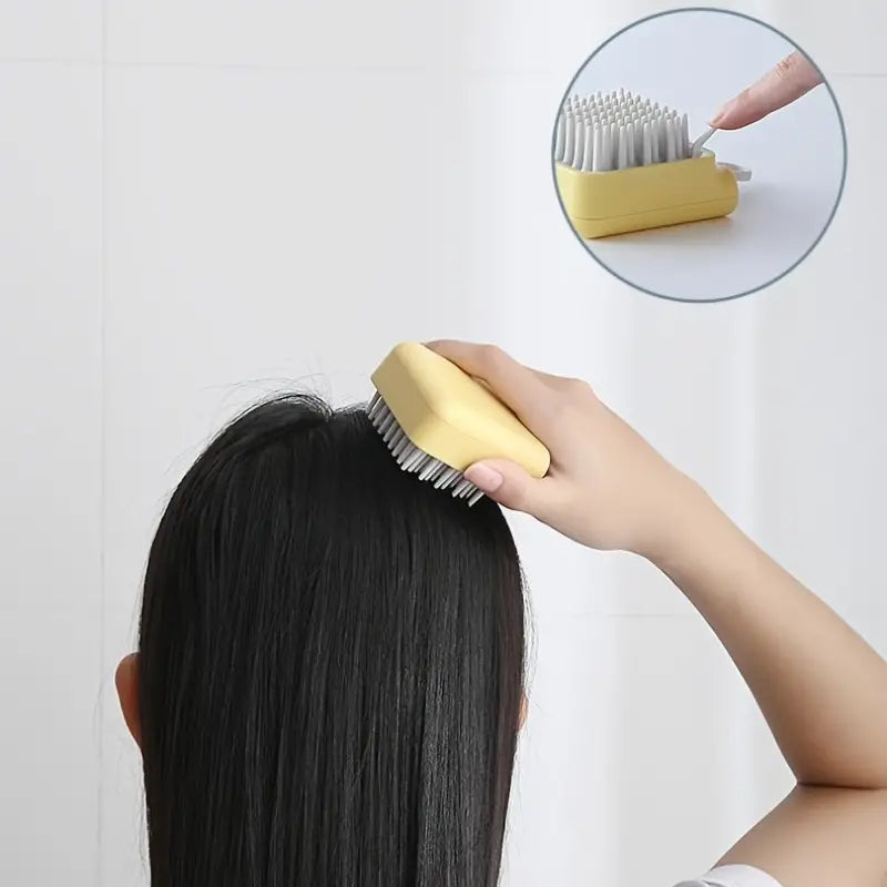 Scalp massage brush being used on hair