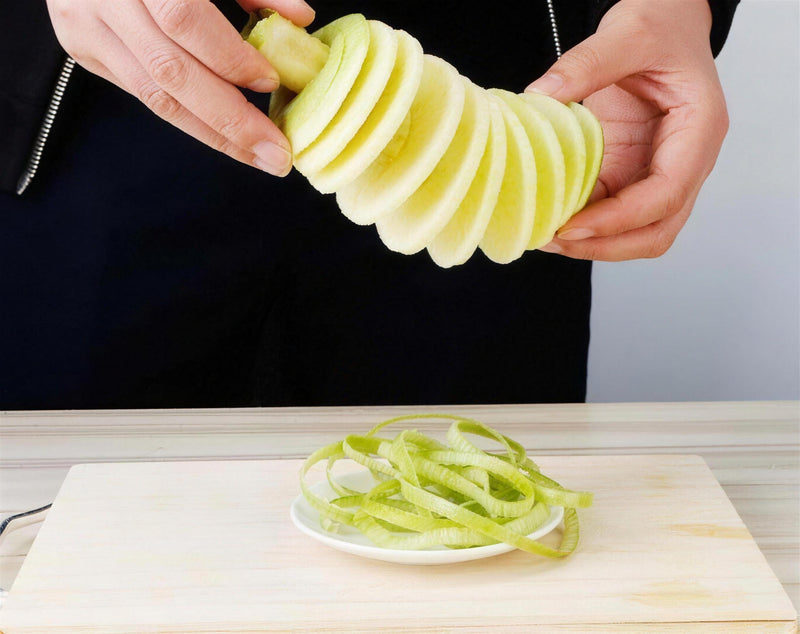 Step 4: a cored, spiral-sliced apple slides off